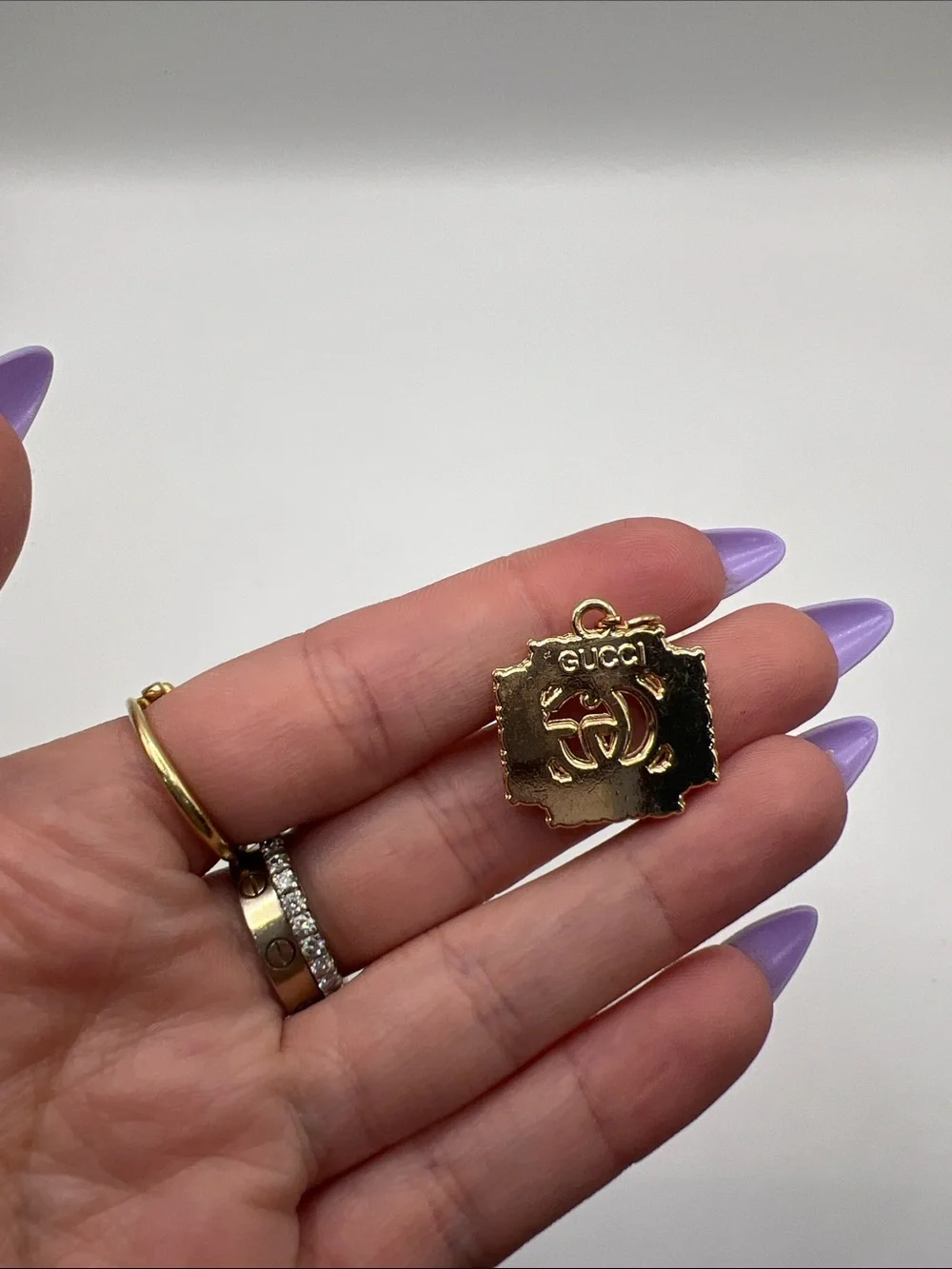 1430. Gold and Black Crystal Logo Charm Pendant